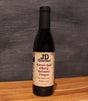 JD Gourmet Cherry Balsamic Vinegar — dark glossy balsamic in a clear bottle, dark sweet cherries, Modena