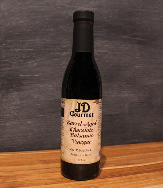 JD Gourmet Chocolate Balsamic Vinegar — dark glossy balsamic in a clear glass bottle, rich chocolate flavor
