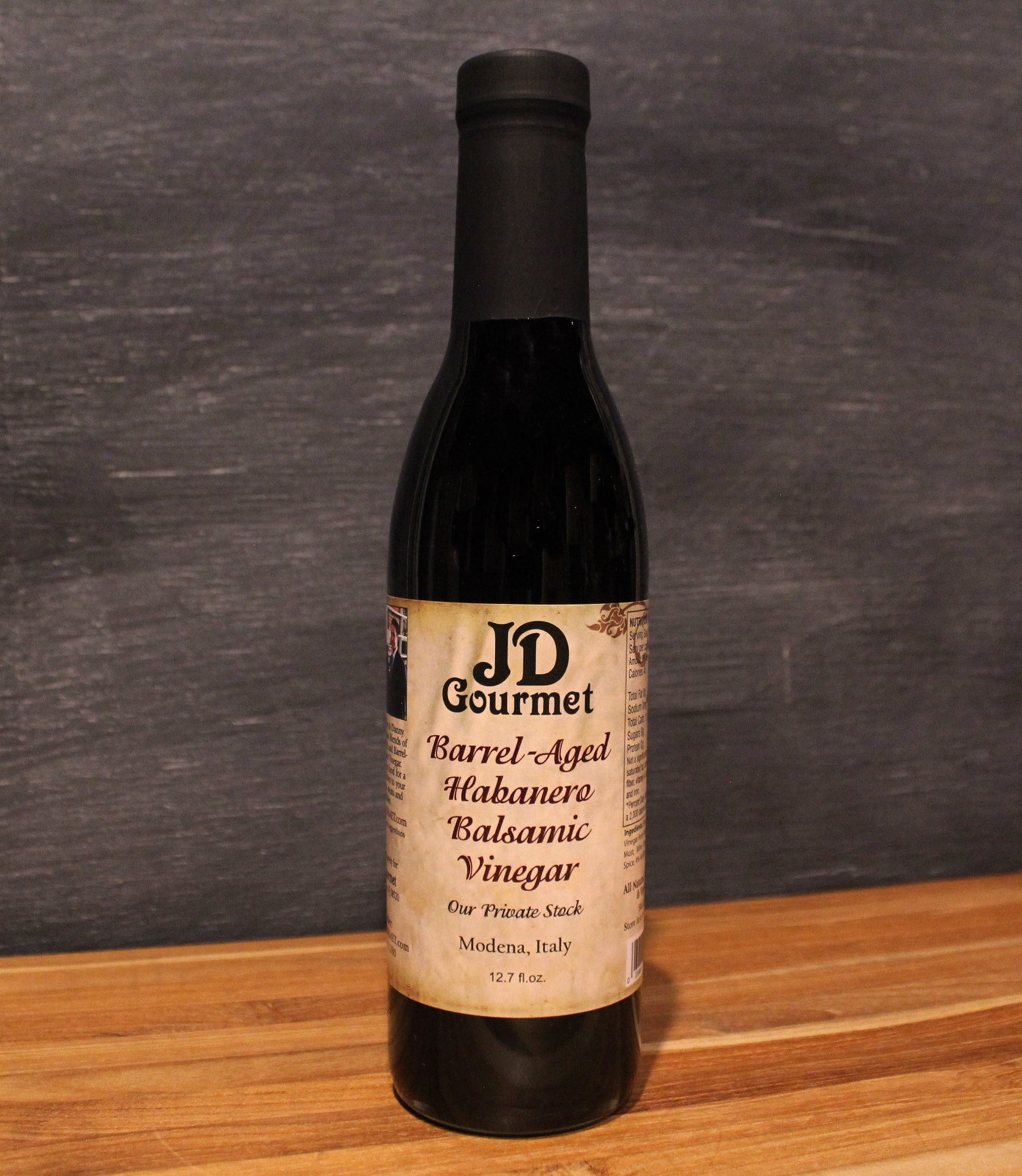 Bottle of JD Gourmet Habanero Balsamic Vinegar, dark barrel-aged Italian balsamic with habanero
