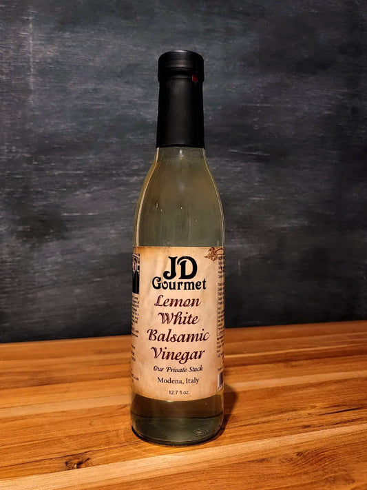 Bottle of JD Gourmet Lemon White Balsamic Vinegar, a light golden white balsamic