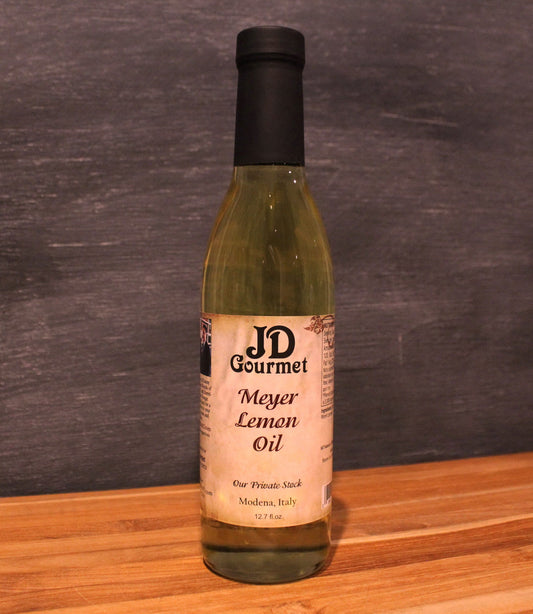 Bottle of JD Gourmet Meyer Lemon Olive Oil, cold-pressed Italian olive oil blended with Meyer lemons