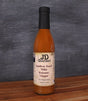 Bottle of JD Gourmet Southern Peach white balsamic vinegar, pale golden and bright