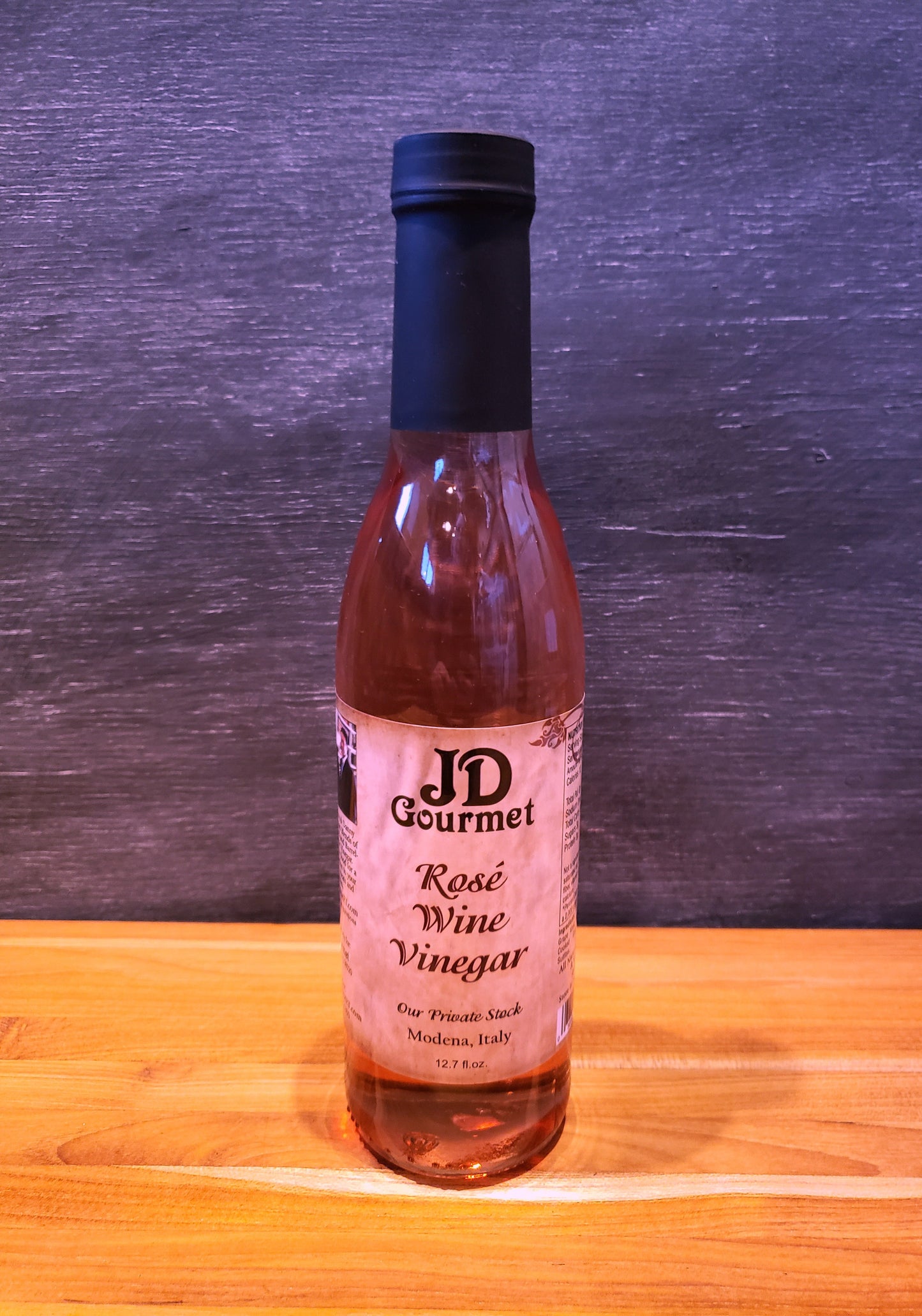 Bottle of JD Gourmet rosé wine vinegar, pale pink and bright