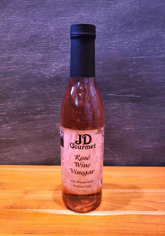Bottle of JD Gourmet rosé wine vinegar, pale pink and bright