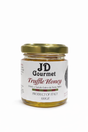 Jar of JD Gourmet Truffle Honey, golden Italian acacia honey infused with black summer truffle