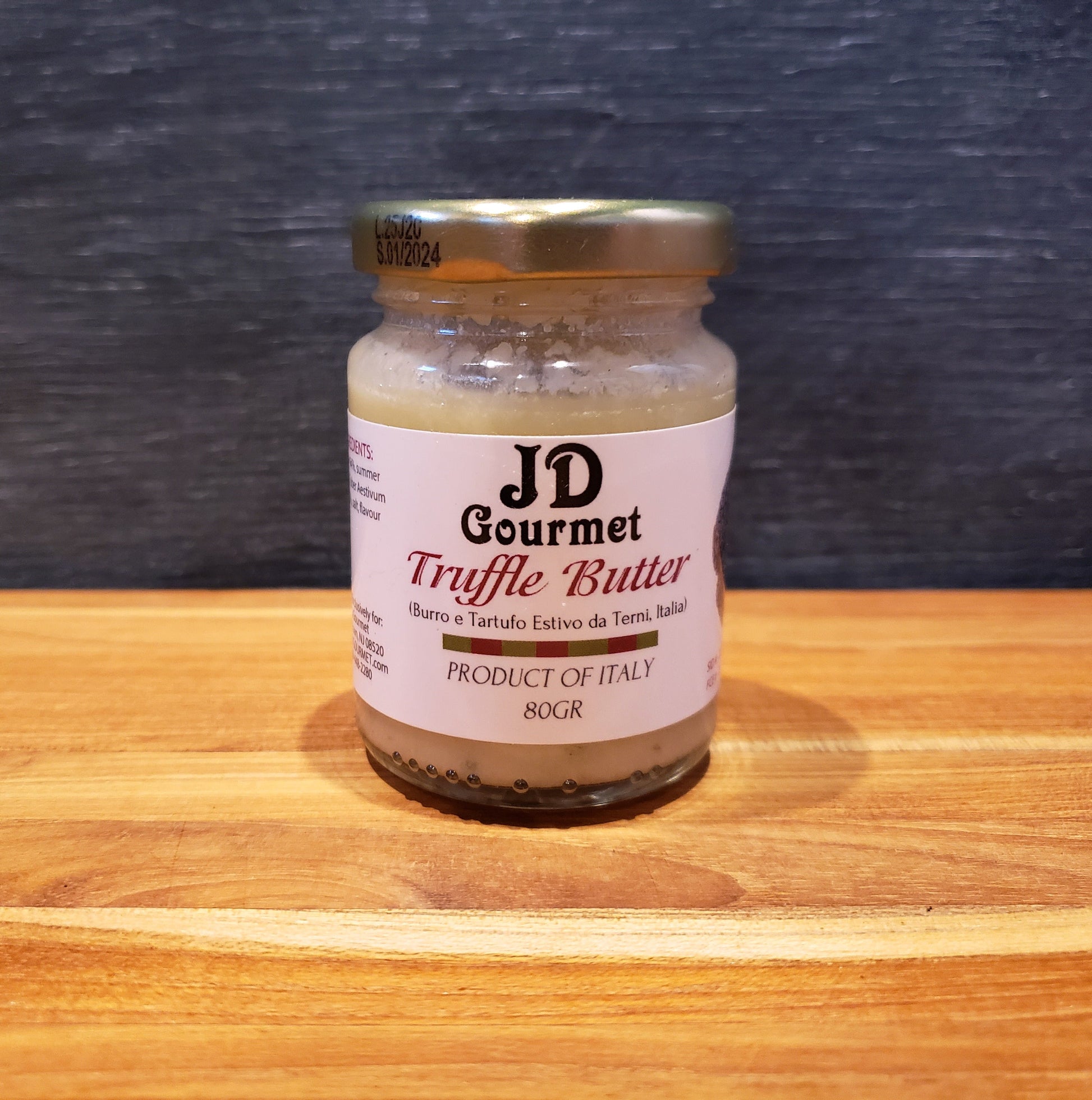Container of JD Gourmet Truffle Butter, a rich savory finishing butter with earthy truffle aroma