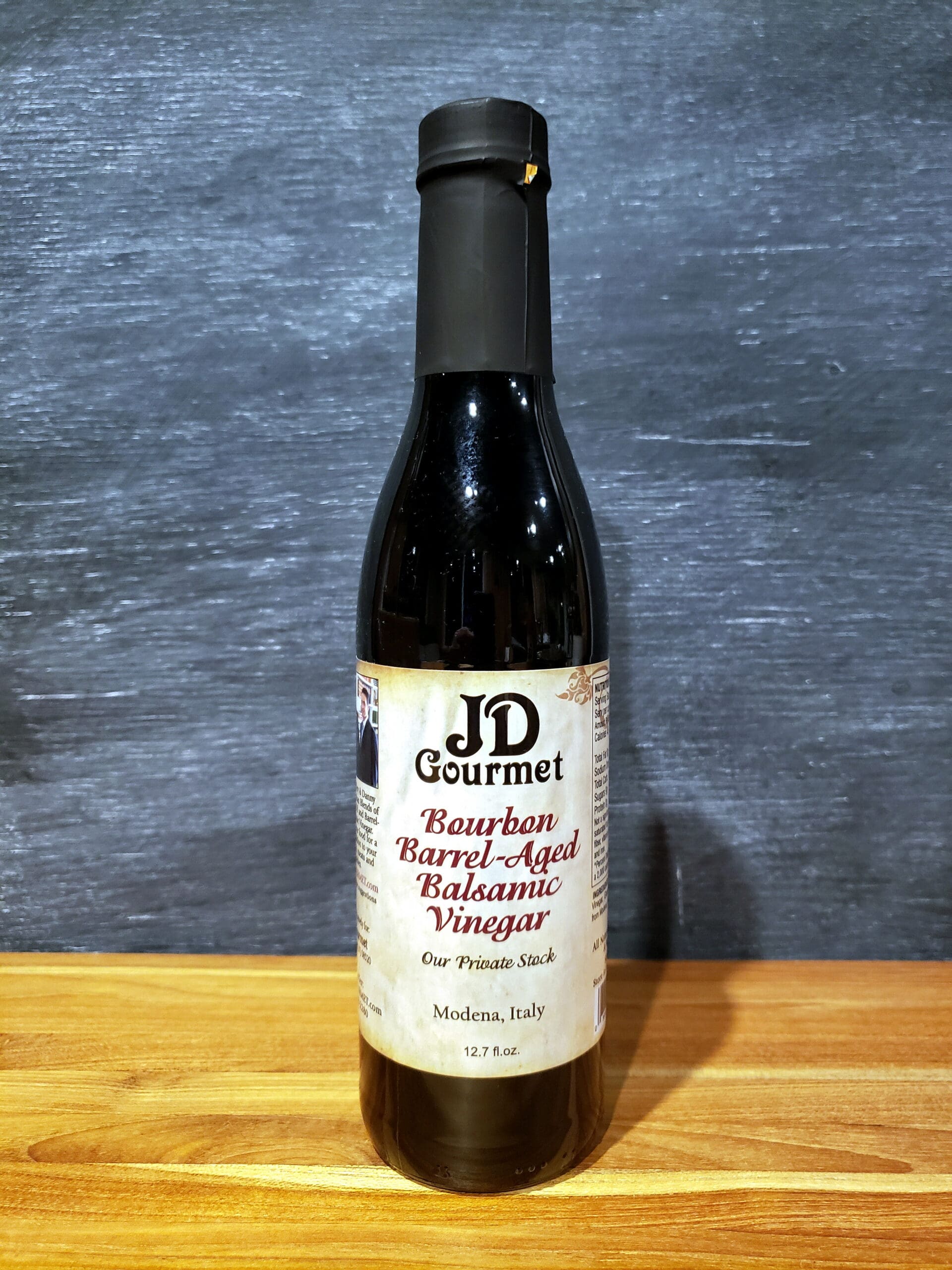 JD Gourmet Bourbon Barrel Aged Balsamic Vinegar Private Stock bottle, dark balsamic aged in a bourbon barrel